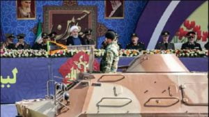 Iran’s president warns the West to ‘stay away’ and unveils ballistic missiles that could strike US bases