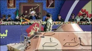 Iran’s president warns the West to ‘stay away’ and unveils ballistic missiles that could strike US bases