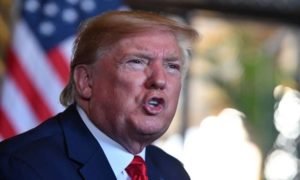 Trump threatens Iran after embassy attack, but remains reluctant to get more involved in region