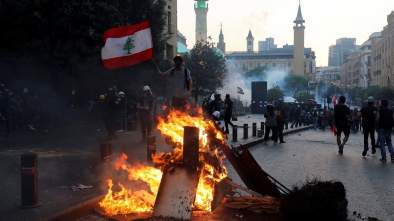 ‘Iran out:’ Anti-Hezbollah protesters march in Lebanon on Beirut blast anniversary