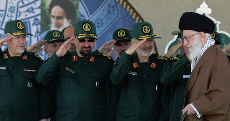 Iranian IRGC commanders salute Ali Khamenei, Iran's supreme leader.