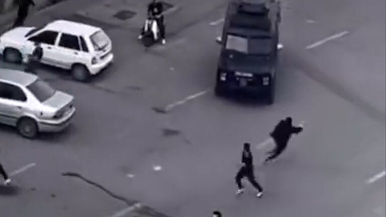 Iranian anti-riot police attempt to drive over unarmed civilians